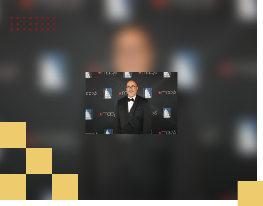 A blurry picture of a man in a tuxedo.